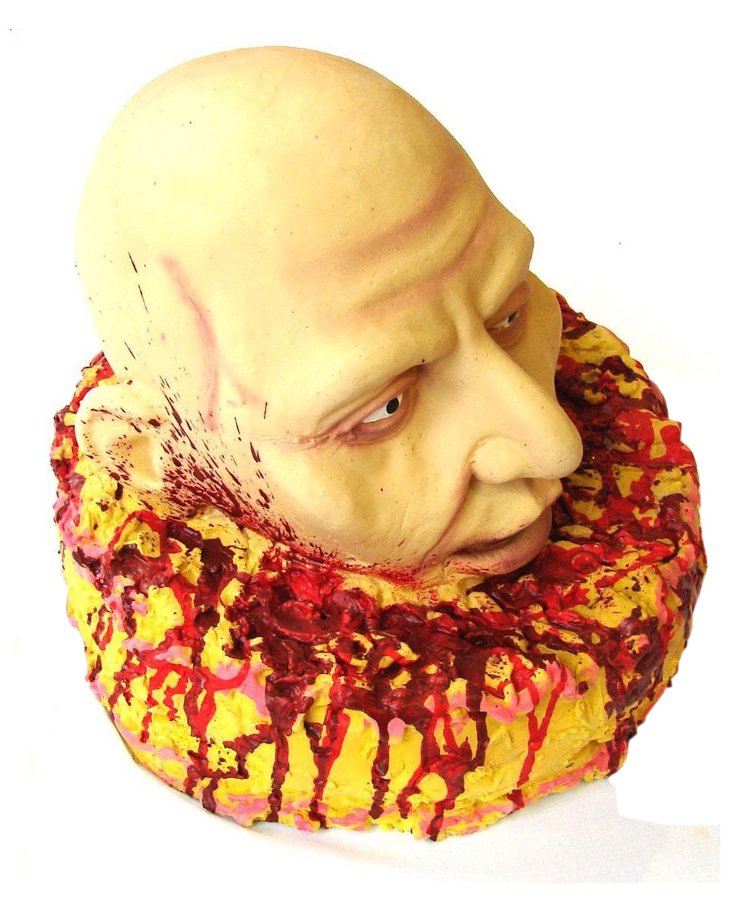 Torte mit blutigem Kopf als Horror-Deko